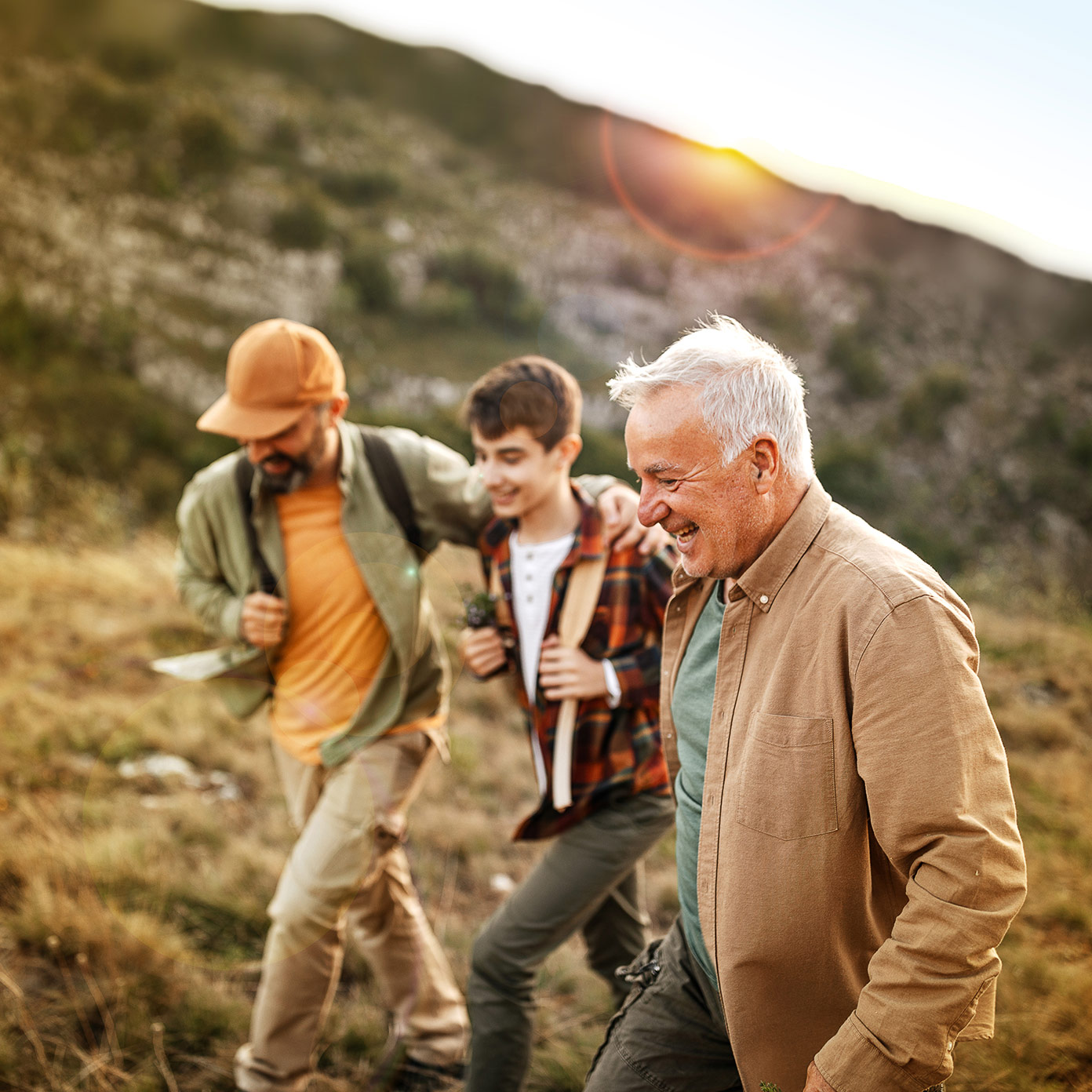 Three generations of healthy men hiking